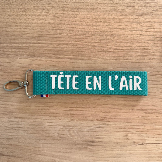 Porte clés, Tête en l'air